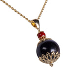 Ciondolo su Kokku sfera corallo e oro