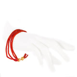 Bracciale Torchon 3 fili corallo e oro