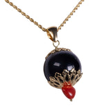 Ciondolo su Kokku cuore corallo e oro